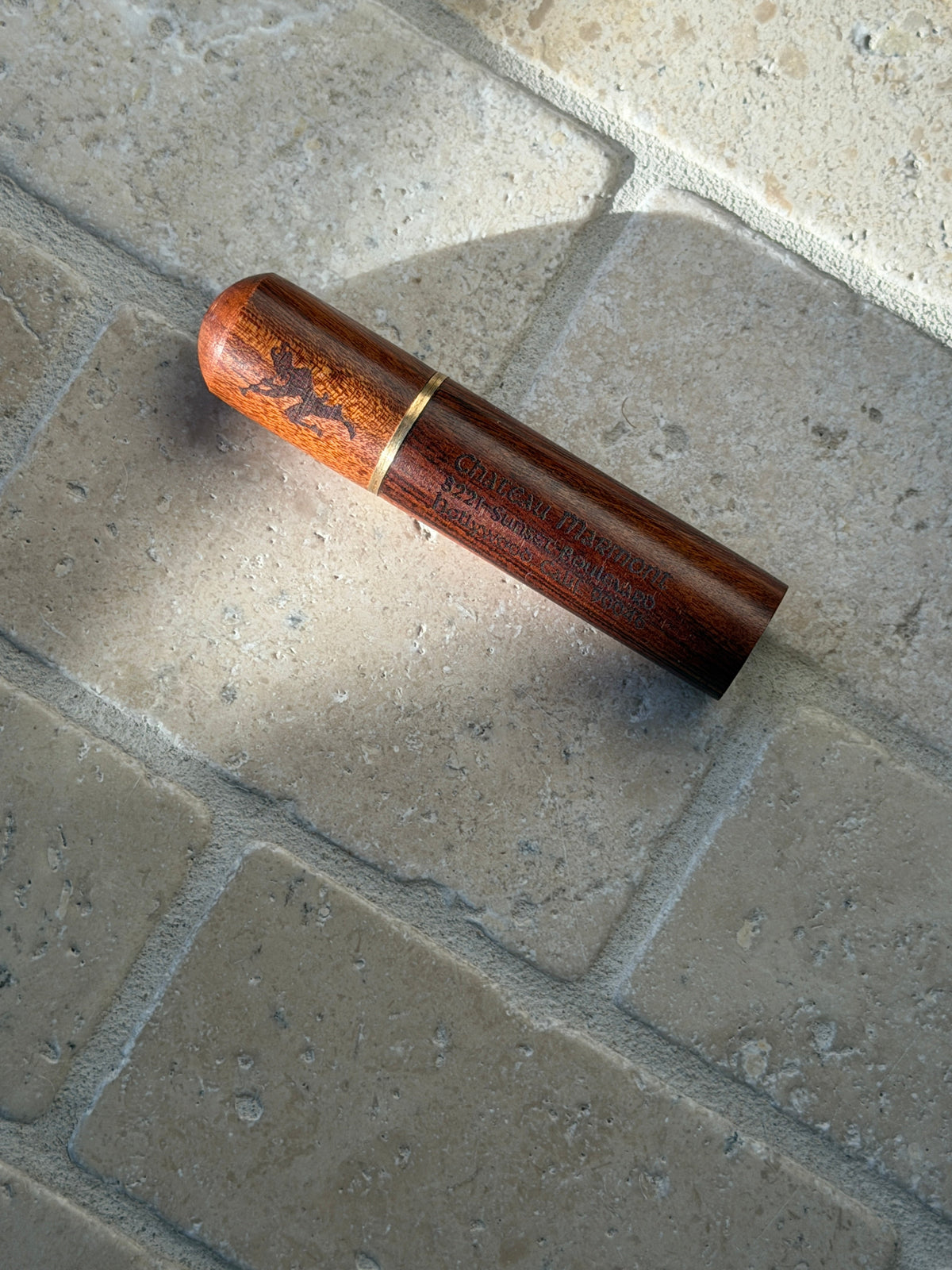 Side profile view of the Chateau Marmont wood accessory
