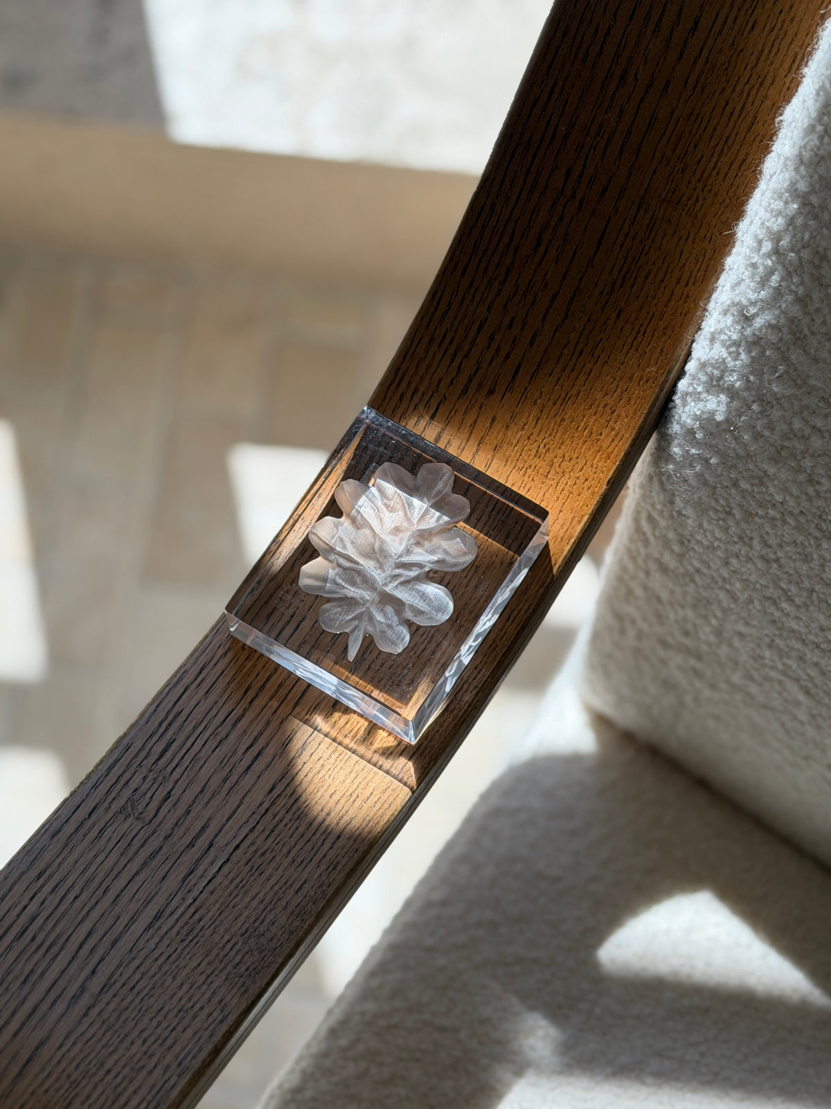 Overhead view of clear rectangular crystal glass paperweight featuring embossed frosted leaf relief by Collectors Gene