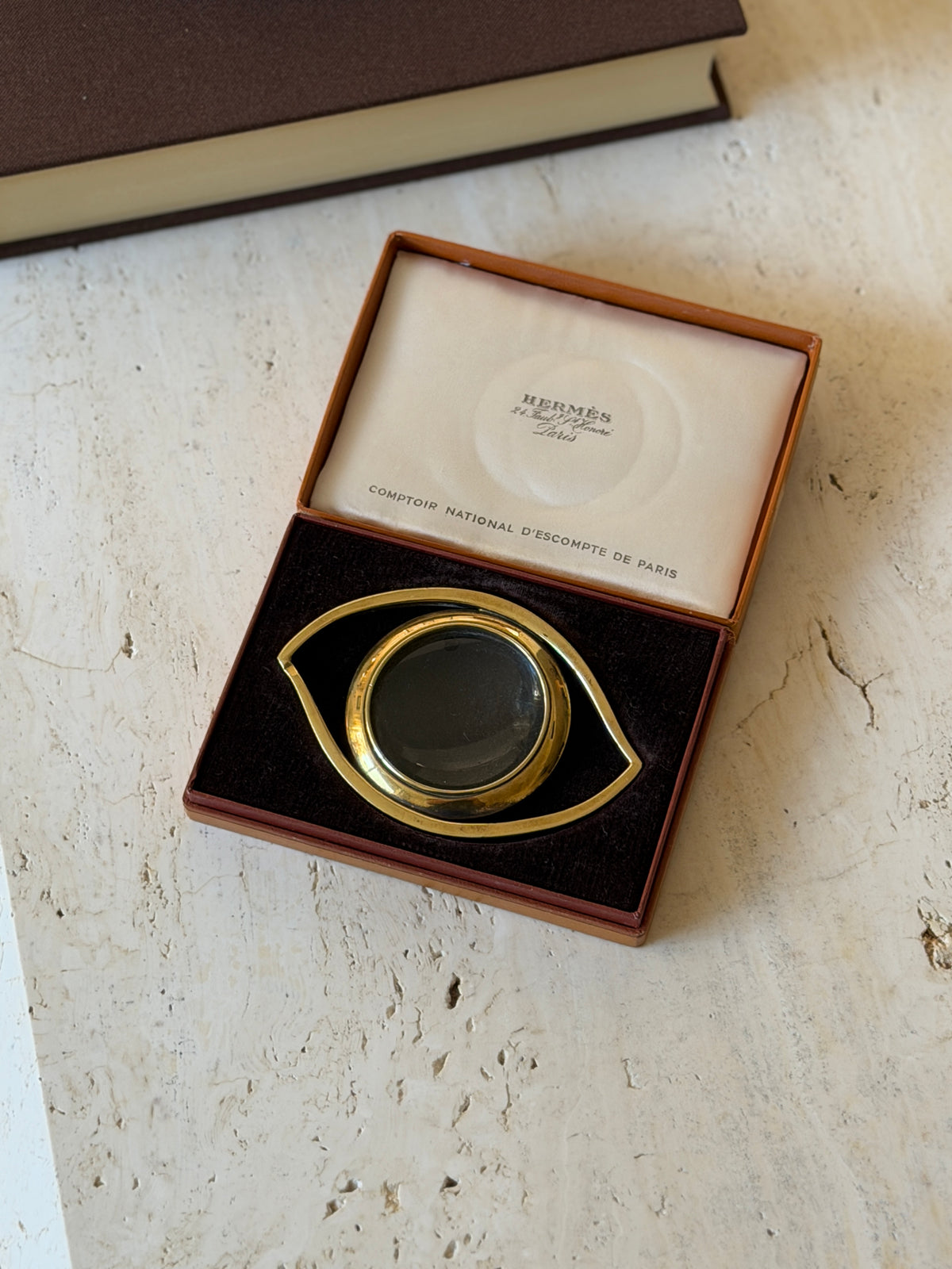 Hermes Cleopatras Eye gilt magnifier in its original tan box with brown velvet insert and satin lid lining printed Hermes Paris