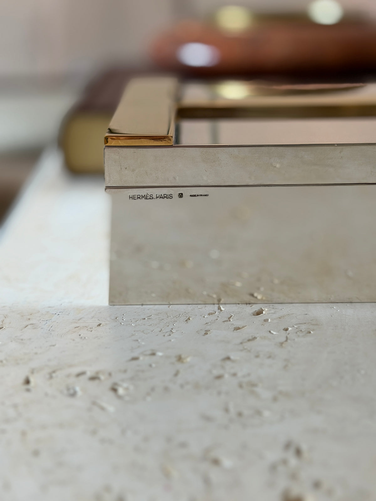 Macro detail of the Hermes Paris stamp on the humidor&