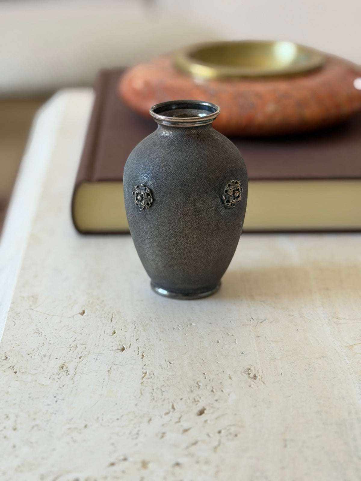 Front view of the Buccellati sterling silver vase with rosette details