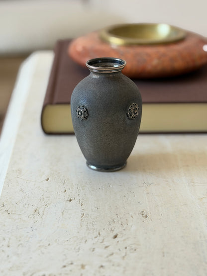 Front view of the Buccellati sterling silver vase with rosette details