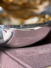 Close detail of the box rim stamped with a maker&