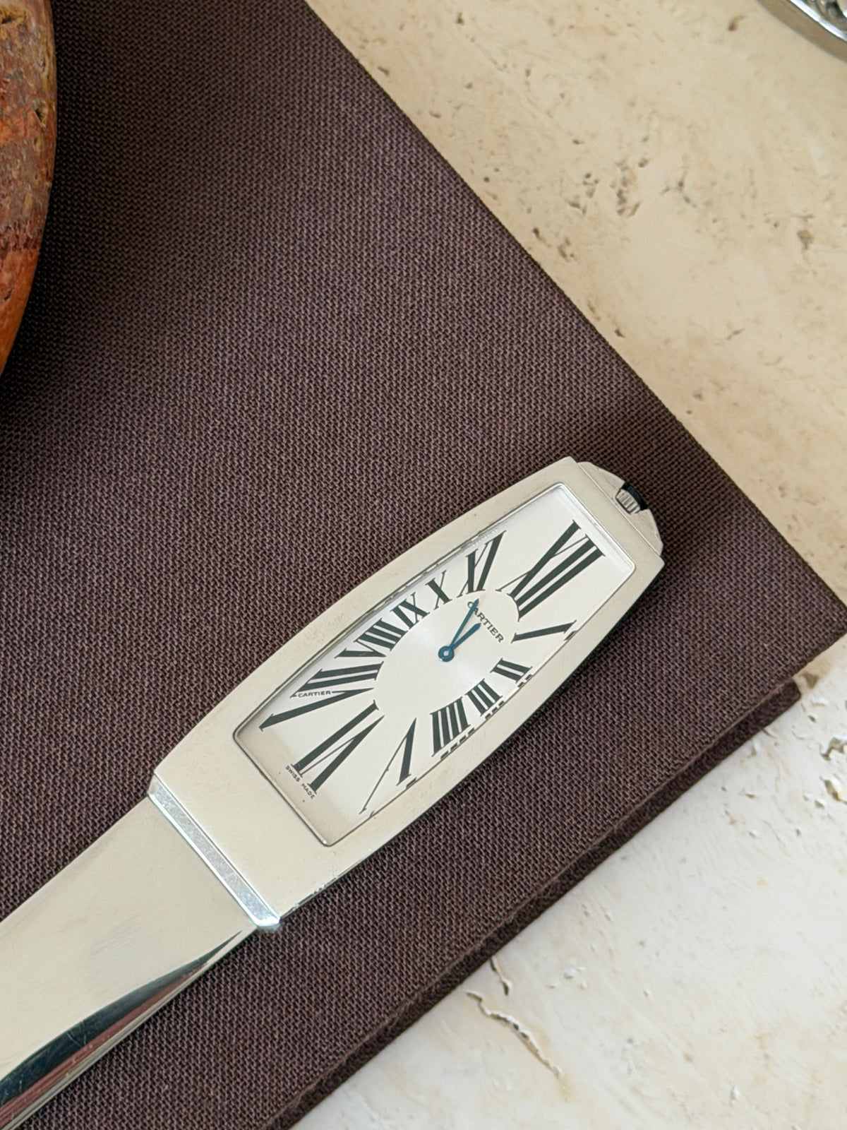 Another close-up of the clock face from the front, showing the hour and minute hands and Roman numerals