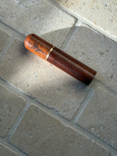 Side profile view of the Chateau Marmont wood accessory