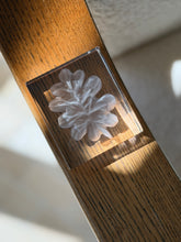 Close-up view highlighting internal frosted glass leaf design in heavy rectangular crystal paperweight