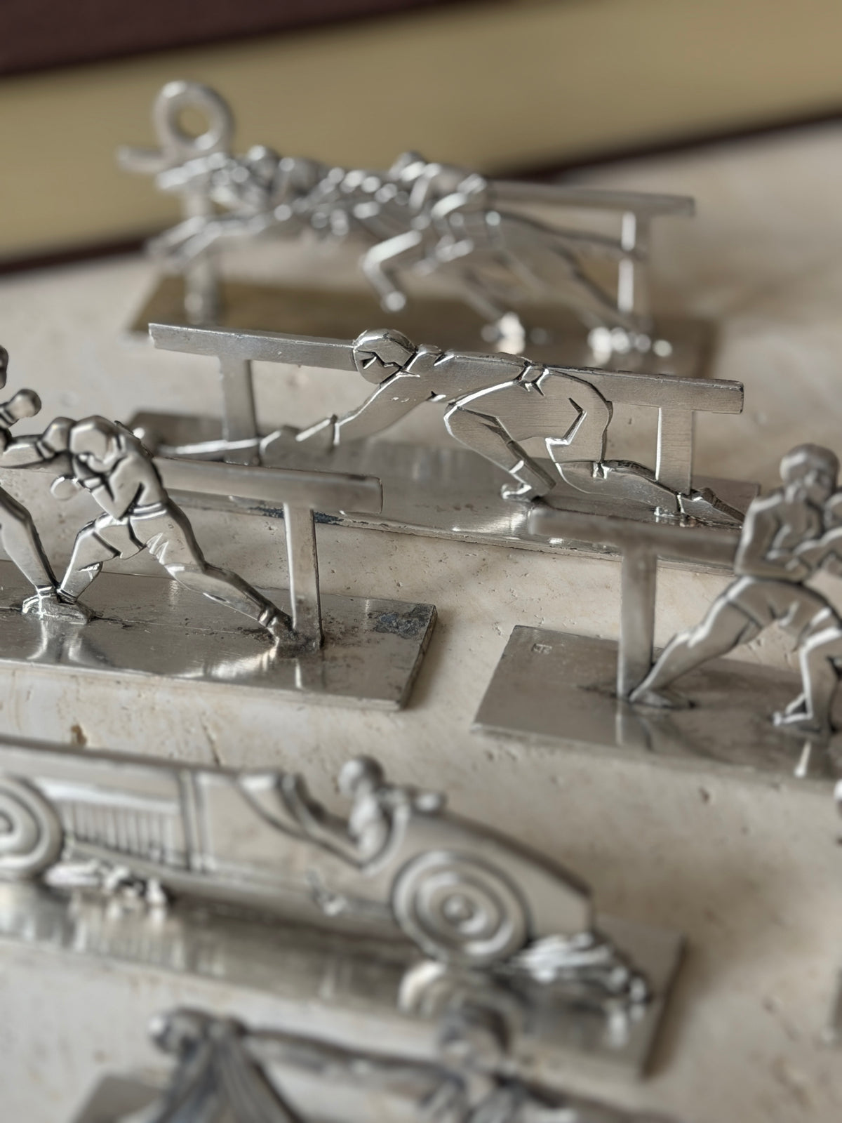Close detail of the fencer and boxing knife rests, a small stamped maker&
