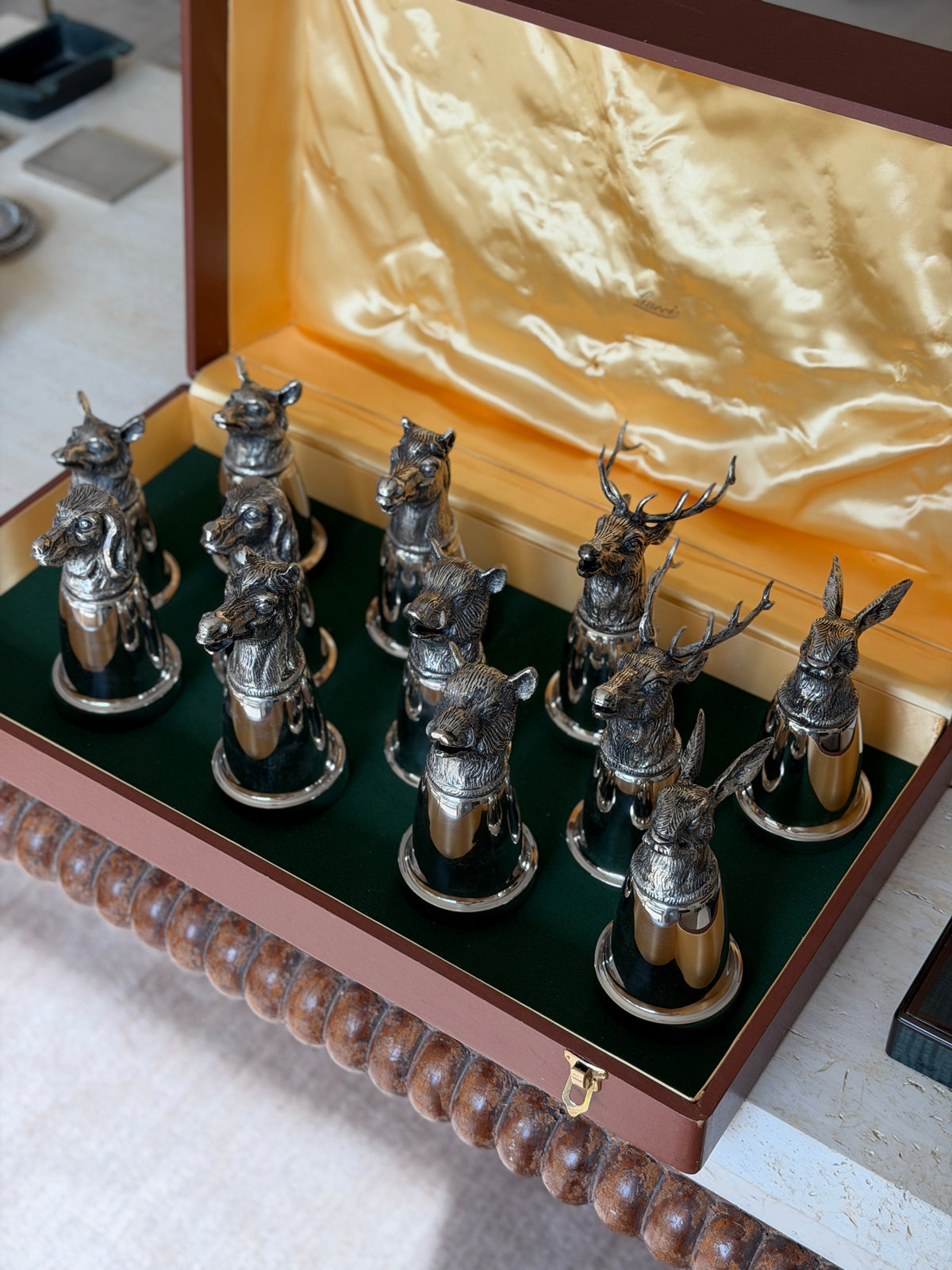 Another overhead angle of the open box showing the full arrangement of stag, horse, hound, hare, fox, and boar head cups standing upright