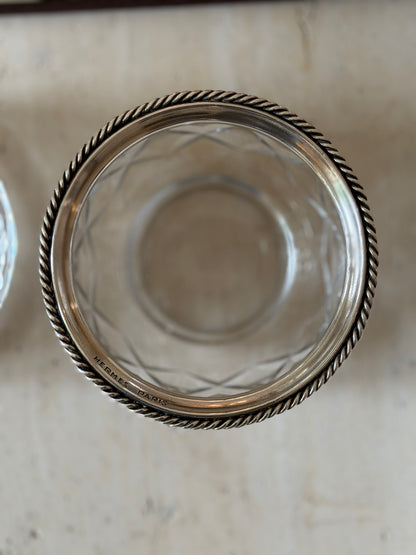 Top-down view into the Hermes crystal bowl showing the Hermes Paris hallmark on its silver rim