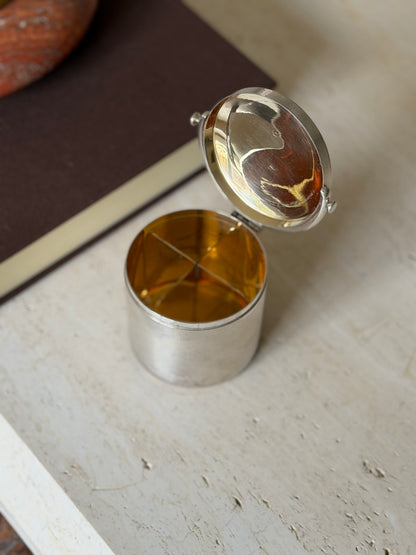 Hermes cigarette box with the hinged lid open, revealing a gilt interior divided into four sections and a gilt lid lining
