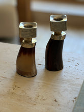 Close-up front view of curved horn and German silver architectural candle holders from Collectors Gene