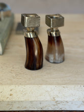 Side-by-side view showing natural grain variations of horn and German silver candlesticks at Collectors Gene