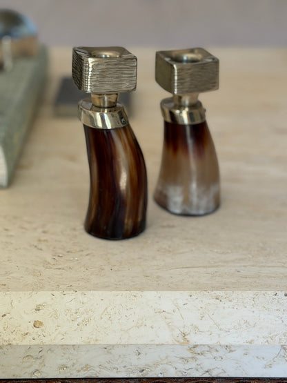 Side-by-side view showing natural grain variations of horn and German silver candlesticks at Collectors Gene