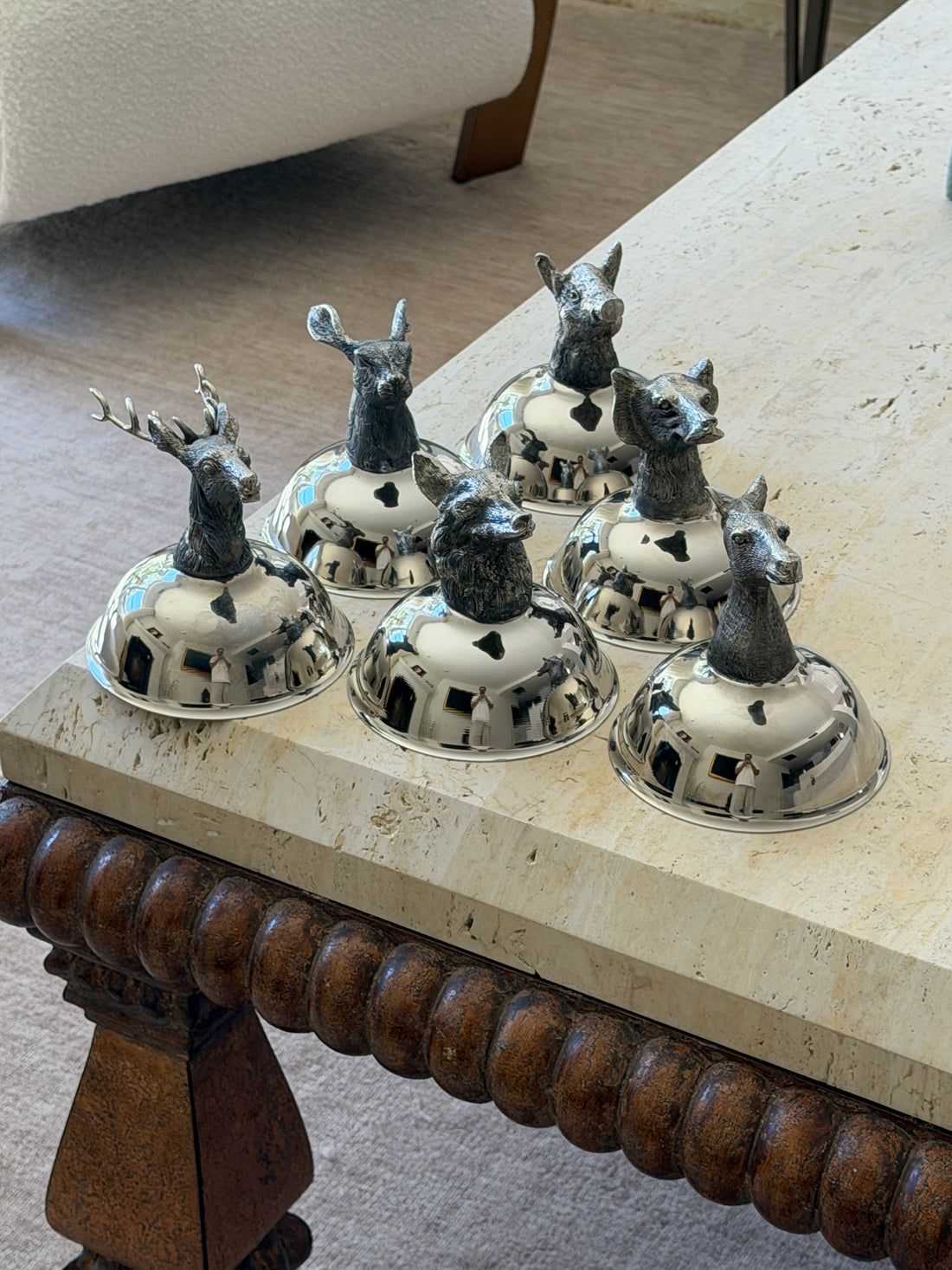 Set of 6 vintage Italian silver-tone animal head stirrup coupes inverted on stone table from Collectors Gene