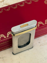 Close up of the cigar cutter end showing the gold must de Cartier plaque, serial number 003866, and Made in France stamp