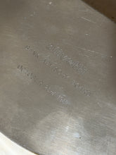 Close up of the engraving on the Olivetti box reading olivetti, Bank Advisory Board, October 23rd 1987
