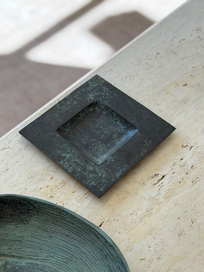 High angle view of square dark verdigris bronze catchall dish with recessed center by Collectors Gene