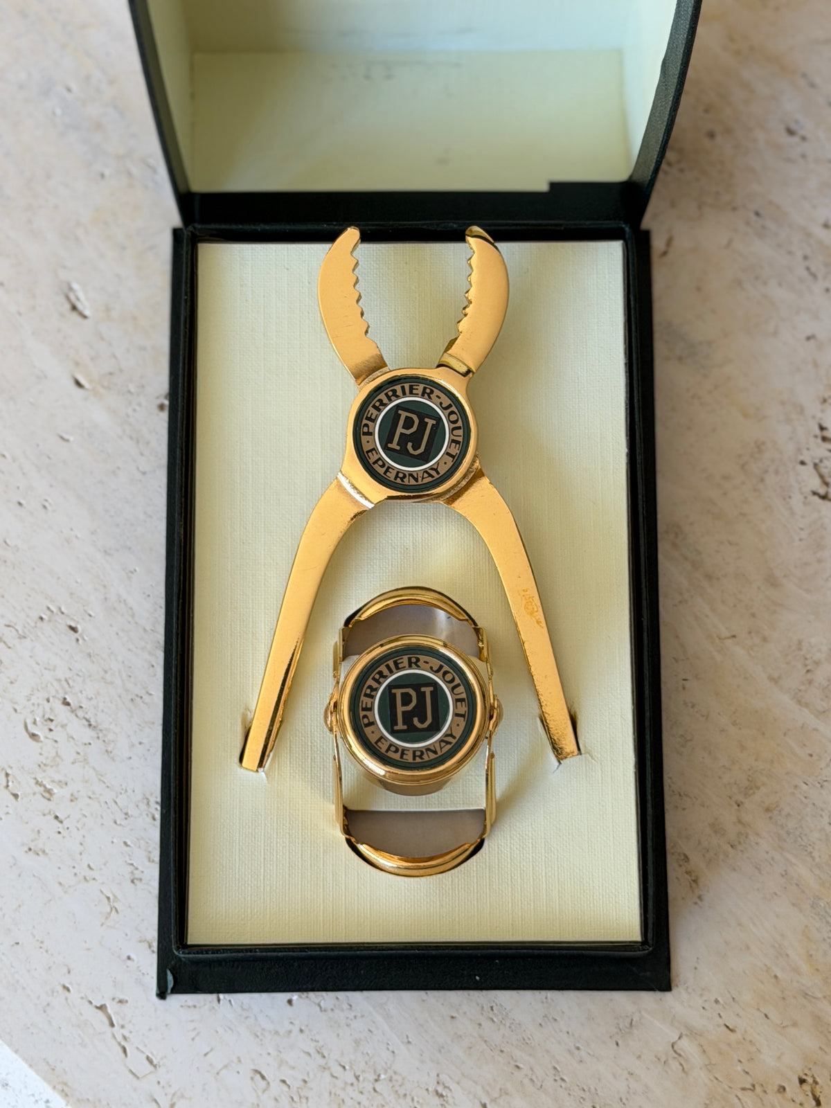 Direct overhead view of open luxury Perrier-Jouët French champagne accessories gift box from Collectors Gene