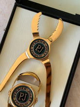 Detailed view of vintage Perrier-Jouët gold-tone champagne pliers bottle opener from Collectors Gene