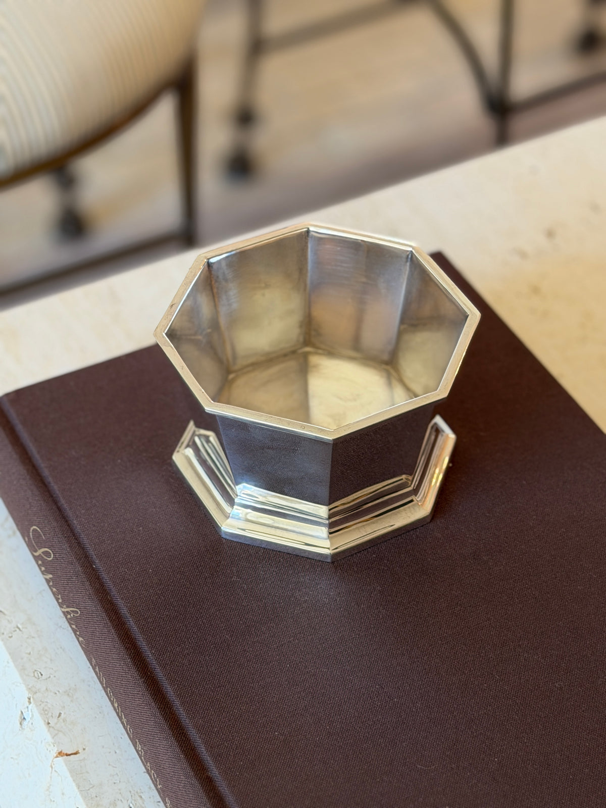 Overhead view of the Ralph Lauren Kingsburgh octagonal nut bowl in polished silver on the Superfine Tailoring Black Style book