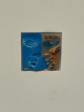 Straight on view of the Berthet relief, the blue face with closed eye meeting the bronze profile at the lips, signed Berthet lower left and numbered lower right