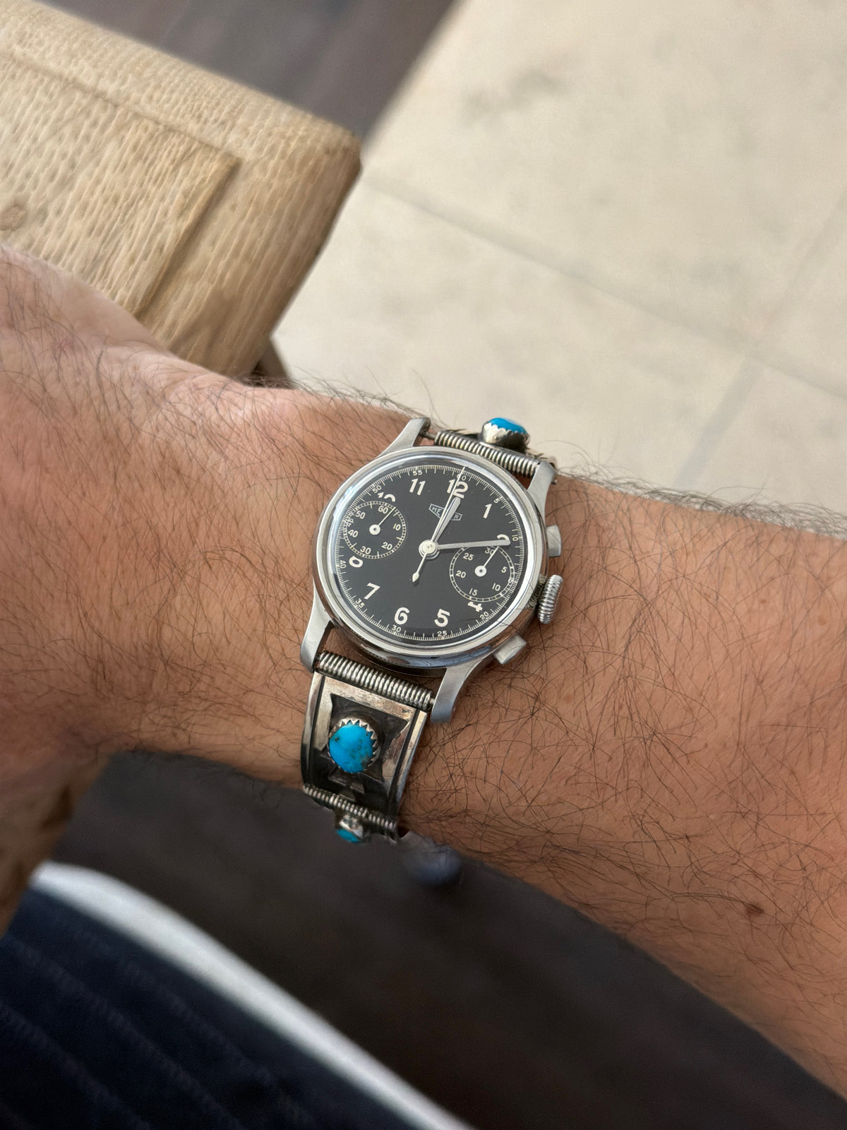 On-wrist view of vintage 1940s Heuer 32mm chronograph on sterling silver Southwestern turquoise link bracelet available at Collectors Gene